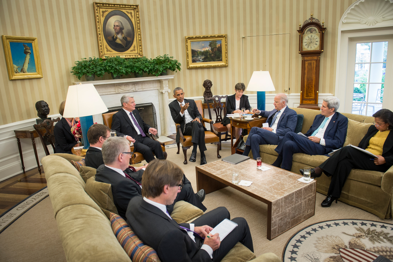 Here is the table with German President Joachim Gauck in October, 2015, holding THREE DRINKS and THREE NAPKINS and ONE NOTEBOOK. Image via Getty.